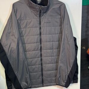 Gray Puffer Jacket with High Collar and Zipper Closure